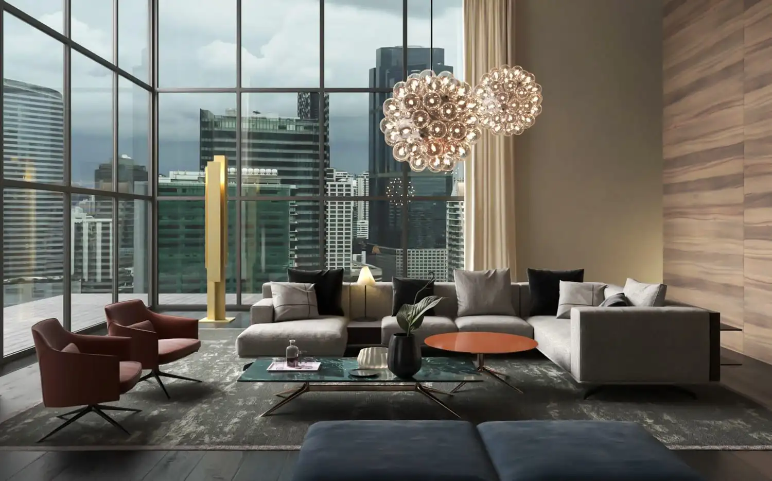 Bespoke residential interior design services in Dubai by RCi Red Chillies Interiors LLC, showcasing a luxurious living room with floor-to-ceiling windows, modern gray sofas, elegant red chairs, and a statement chandelier with a Dubai cityscape view